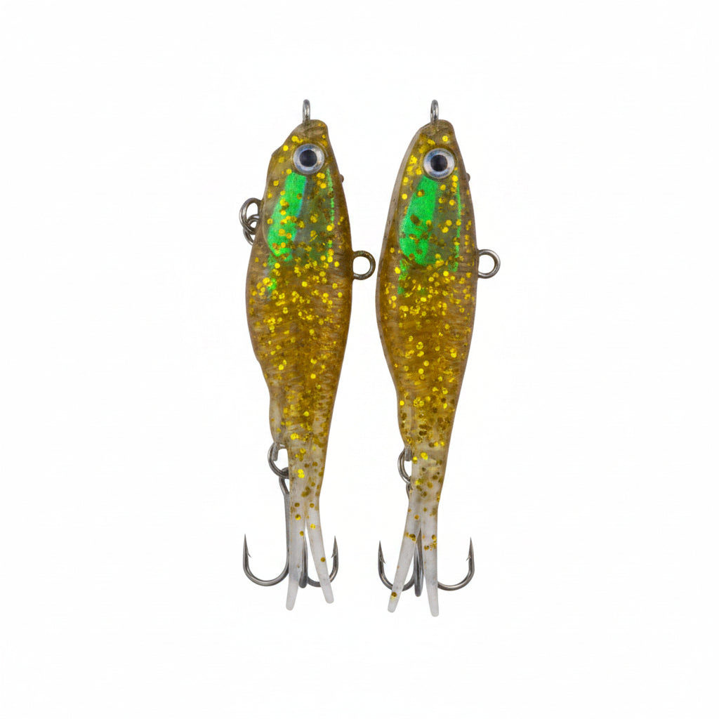 Soft plastic fishing lures, gold-green glitter bodies with treble hooks, vertical view
