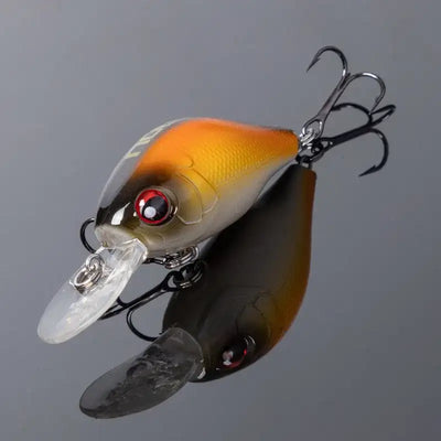 Orange and white crankbait fishing lure with clear lip and treble hooks