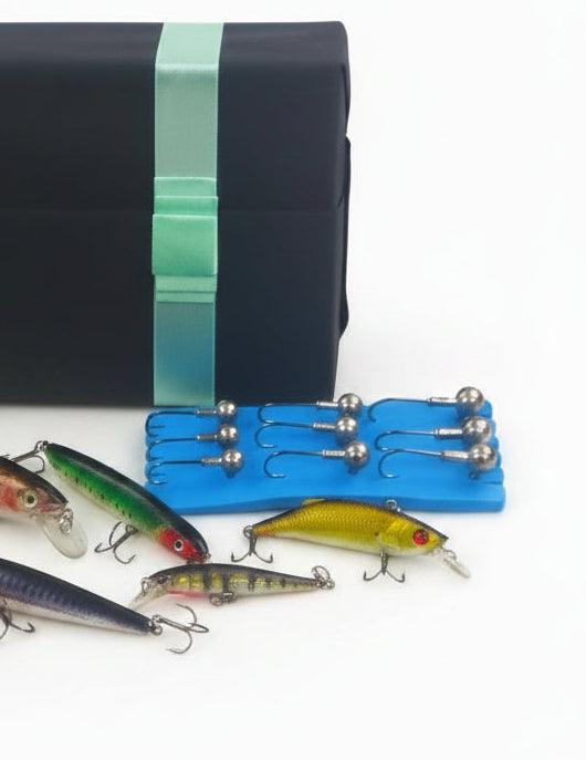 Fishing lure gift set with blue blister tray of metal hooks plus green and yellow lures.