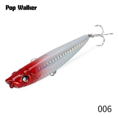 Red and silver popper fishing lure with treble hooks, glossy hard bait