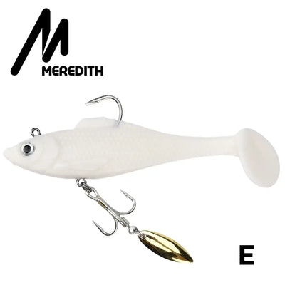 White soft plastic swimbait lure with gold spinner blade and treble hooks