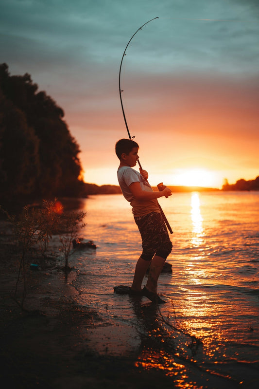 Angler fishing at sunset with modern fishing lures and tackle from Cast N Go Australia