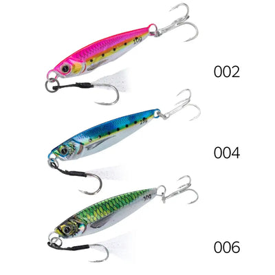 Three metal jig fishing lures in pink, blue, and green, each with treble hooks