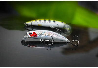 Two silver sinking minnow lures with treble hooks, one with red head details