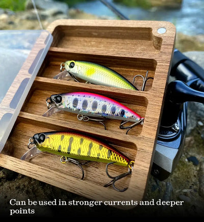 TSURINOYA Intruder 51S sinking minnow lure lineup in open wooden box, treble hooks visible
