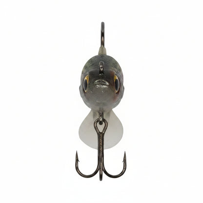 Front view fishing lure with round gray head, yellow eyes, and double treble hooks