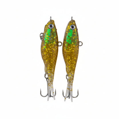 Soft plastic fishing lures, gold-green glitter bodies with treble hooks, vertical view