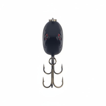 Lipless crankbait lure, dark oval body with red eyes and two treble hooks