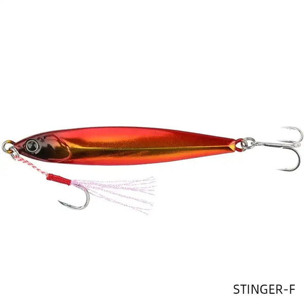 Metal fishing jig lure in red-gold with dark head and white skirt, double hooks
