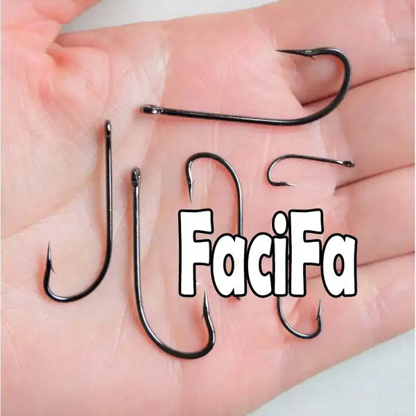 Black long-shank barbed fishhooks, several hooks held in a palm