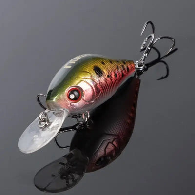 Floating crankbait lure with green-brown spotted body, red eye, clear lip, treble hooks
