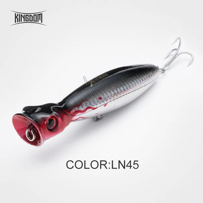 Floating popper fishing lure, black back, red accents, white body, red mouth, 2 treble hooks