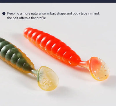 Ribbed silicone swimbait lure close-up, bright orange body with light tail and paddle