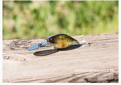 Hard crankbait minnow lure with yellow body, red eye, and two treble hooks