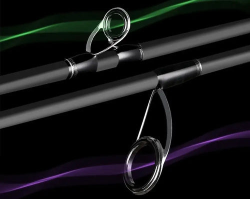 Fishing rod guide ring close-up on black blank with green accent near reel seat