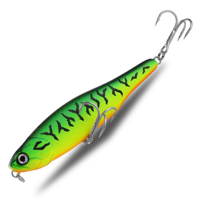 Topwater pencil fishing lure with bright green-yellow body, black script, treble hooks