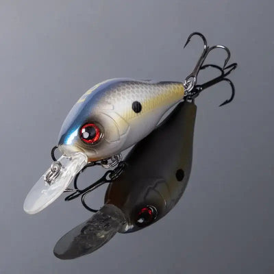 Floating crankbait lure with white-blue body, red eye, clear lip, treble hooks