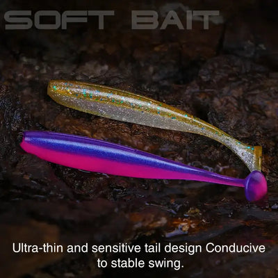 Soft T-tail worm lure in gold-sparkle with purple second lure on rocky surface