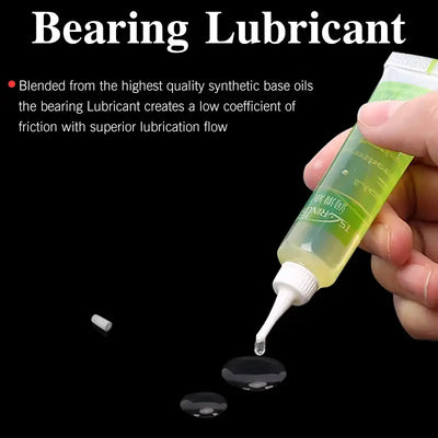 Tsurinoya bearing lubricant squeeze tube with narrow nozzle dispensing a clear drop