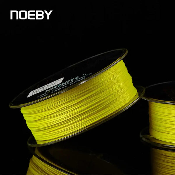 Light yellow braided fishing line spool with printed label on the side and coiled line
