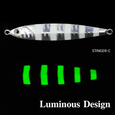 Silver striped metal jig lure with luminous accent bars and metal eyelet attachment