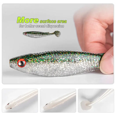 Noeby paddle tail shad swimbait held in hand, silver body with green speckle