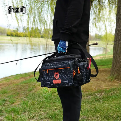 Black fishing tackle shoulder bag worn outdoors with front organizer pouches