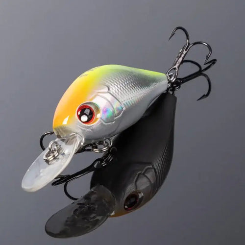 Yellow and silver crankbait fishing lure with clear lip and treble hooks
