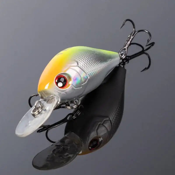 Yellow and silver crankbait fishing lure with clear lip and treble hooks