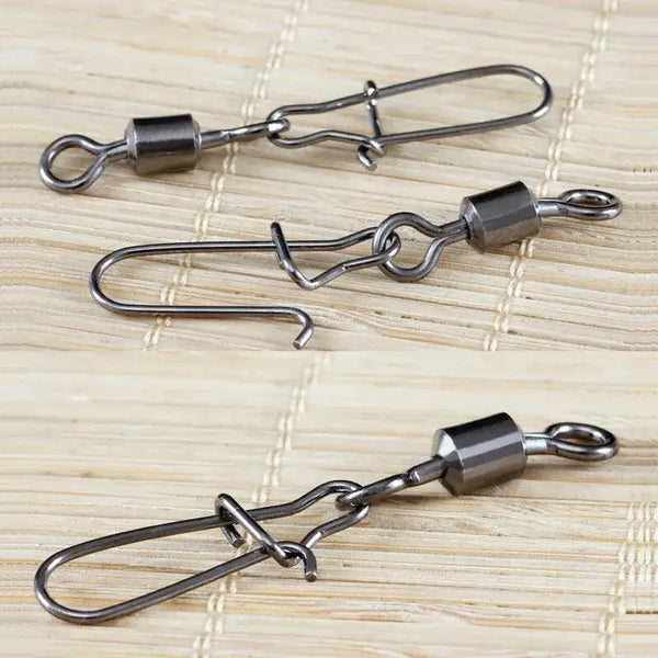 Stainless steel rolling swivel snap connectors, close-up view of three units