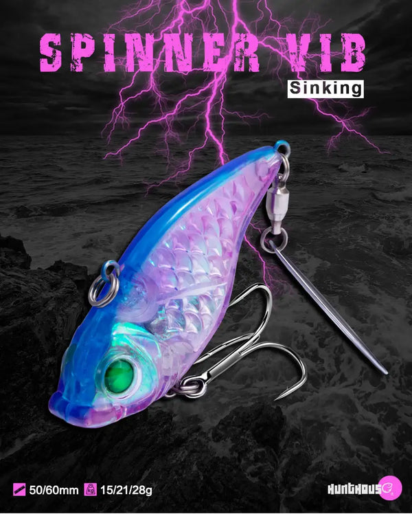 Transparent blue-purple spinner fishing lure with 3D eye, treble hooks, sinking body.