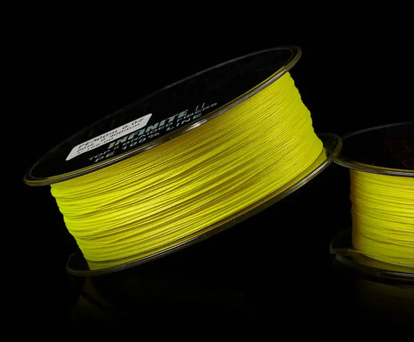 Light yellow braided fishing line on spool, multifilament PE line