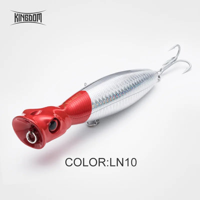 Floating popper fishing lure, red head and midsection, silver-white body, 2 treble hooks
