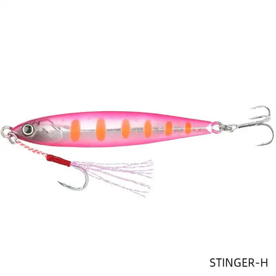 Metal fishing jig lure in pink with orange stripes and white skirt, double hooks