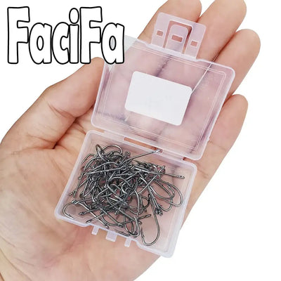 Baitholder fishing hooks in clear plastic case, dark metal hooks held in hand