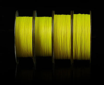 Light yellow braided fishing line spools side-by-side with visible coiled strands