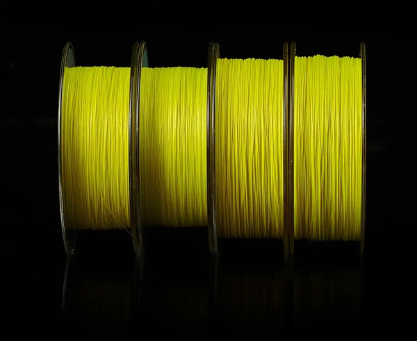 Light yellow braided fishing line spools side-by-side with visible coiled strands