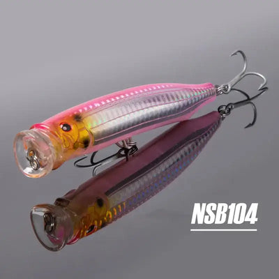 Two topwater feed popper lures, pink and dark red bodies, treble hooks, NSB104