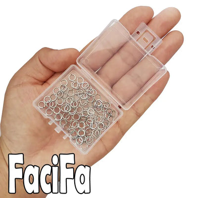 Stainless steel double oval split rings in clear organizer held in hand