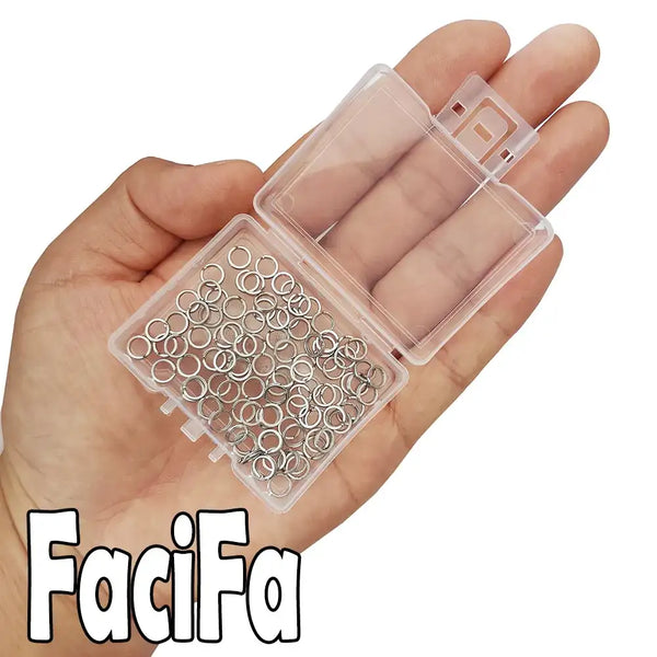 Stainless steel double oval split rings in clear organizer held in hand