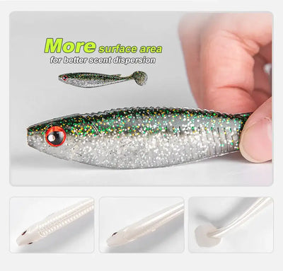 Noeby paddle tail shad swimbait held in hand, silver-black speckle with green sparkle