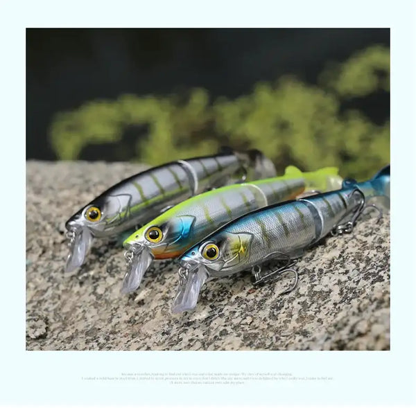 Multi-jointed minnow hard bait set in silver, green, and blue with treble hooks.