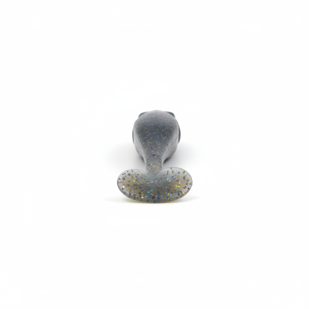 Soft lure tail detail, gray-blue with gold speckles on paddle tail