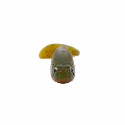 Soft paddle tail lure head with round eye and dark green-brown, speckled finish