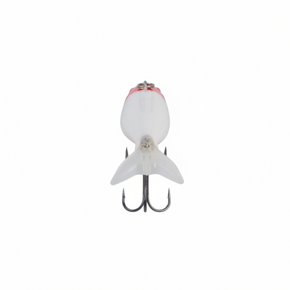 White fishing lure with red top panel and two treble hooks