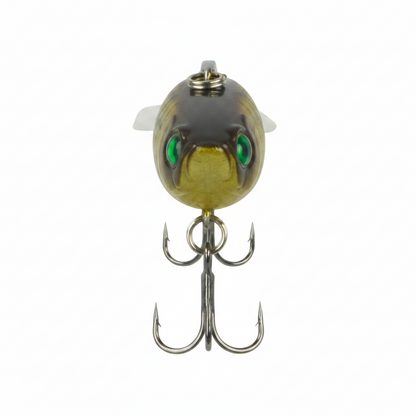 Fishing hard body lure head-on with green eyes, olive-gold body and treble hooks