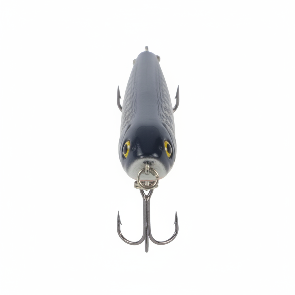 Surface walking-dog fishing lure, front view, dark blue speckled body, yellow eyes, treble hooks