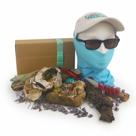 Fishing tackle gift box with assorted lures and baits, blue face covering