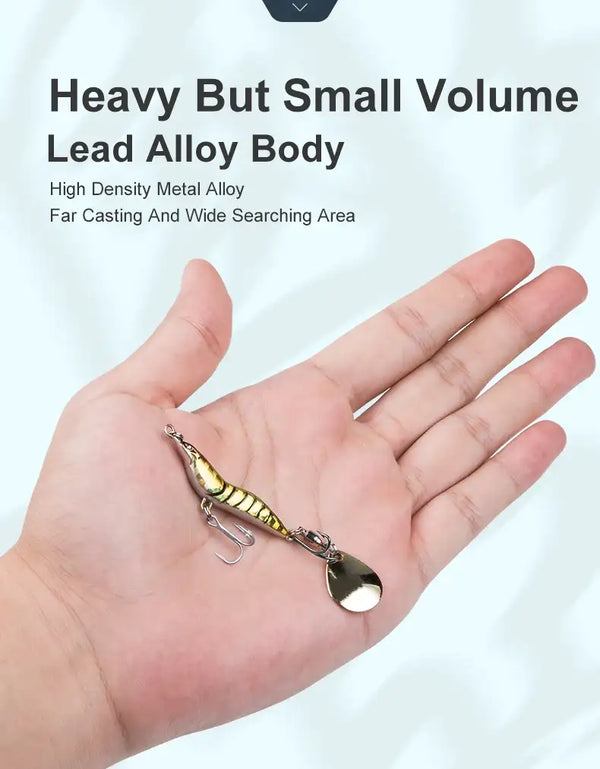 Artificial shrimp spinner lure, yellow-green body in a hand with silver spoon blade and hooks.