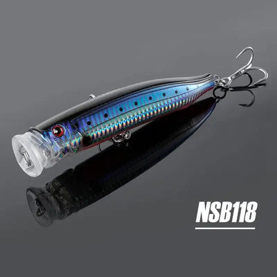 Noeby feed popper topwater lure, blue metallic body with dark accents and treble hooks
